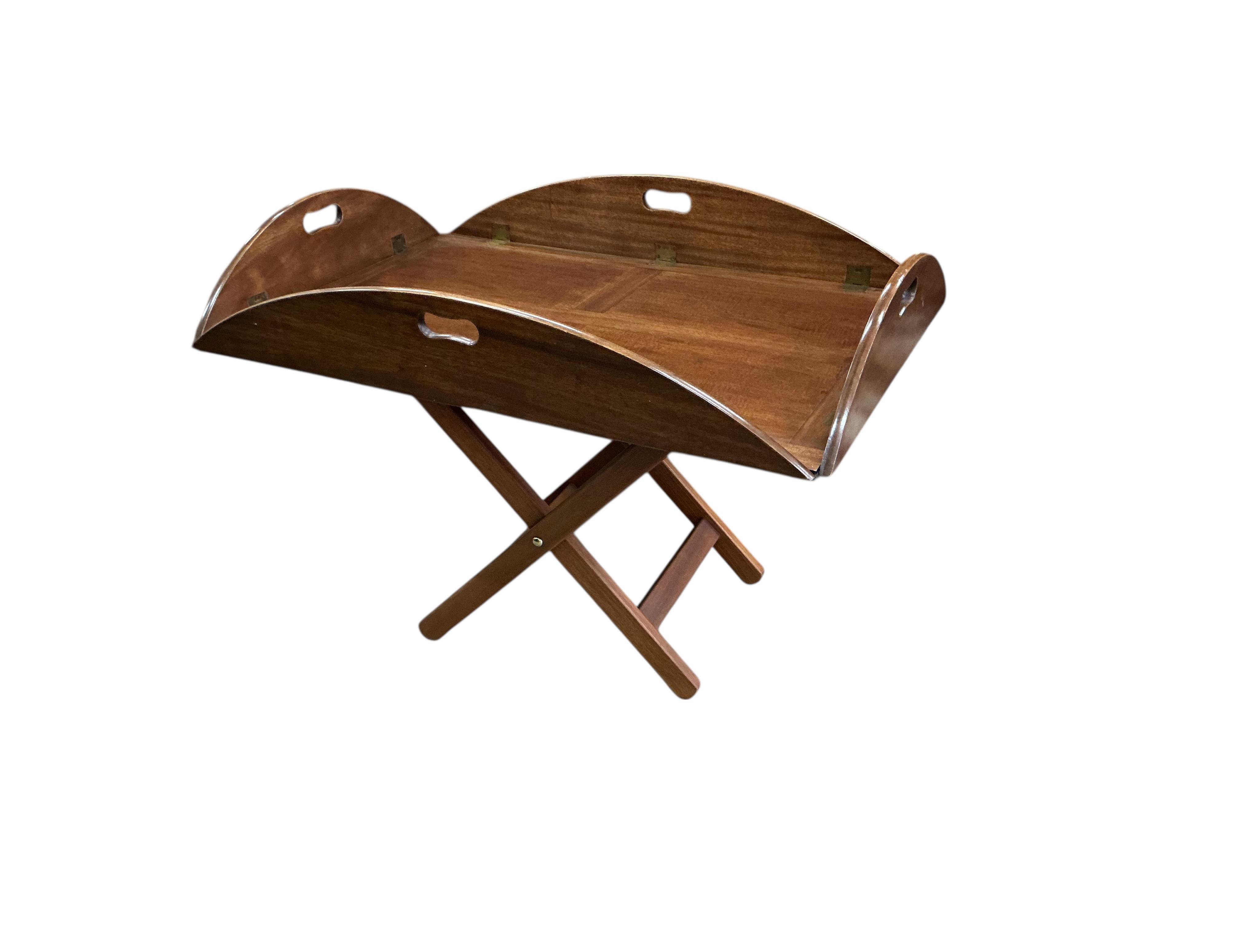 A reproduction George III style mahogany butler's tray / occasional table on folding stand, width 94cm, depth 64cm, height 65cm